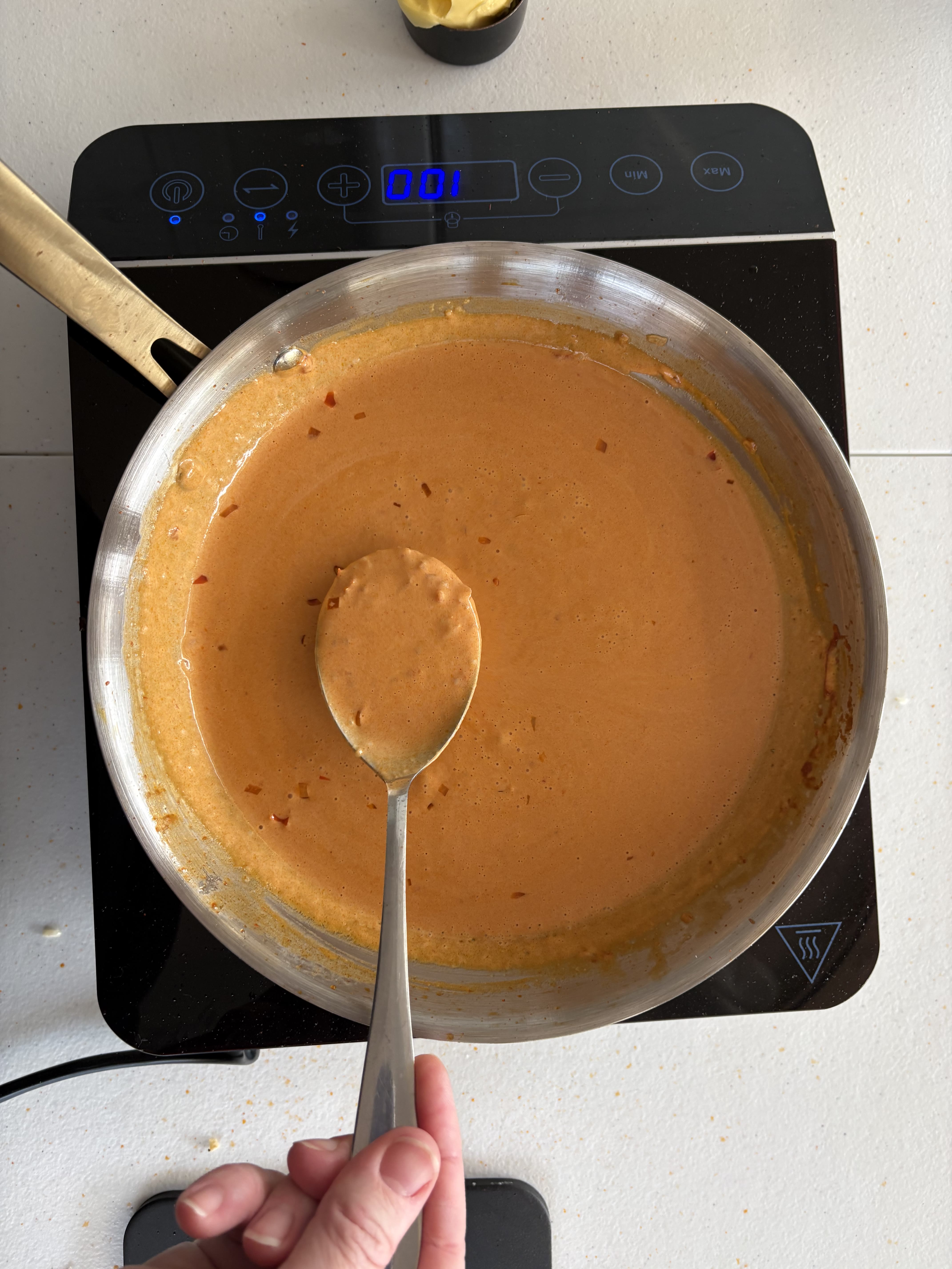 Vodka pasta sauce before adding pasta — bright orange and glossy